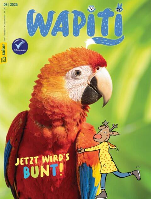 Titelbild der Kinderzeitschrift 'Wapiti' vom Sailer Verlag. Ein farbenfroher Papagei mit rotem Gefieder und blauen Flügeln ist prominent abgebildet. Rechts unten ist eine fröhliche, gezeichnete Figur abgebildet, die ein gelbes Kleid trägt und die Arme breit ausstreckt. Darüber steht der Text 'Jetzt wird's bunt!'. Das Layout ist lebhaft und farbenfroh gestaltet.
